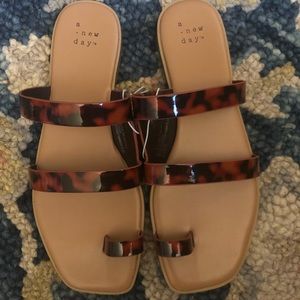 Brand new tortoise shell sandals never worn
